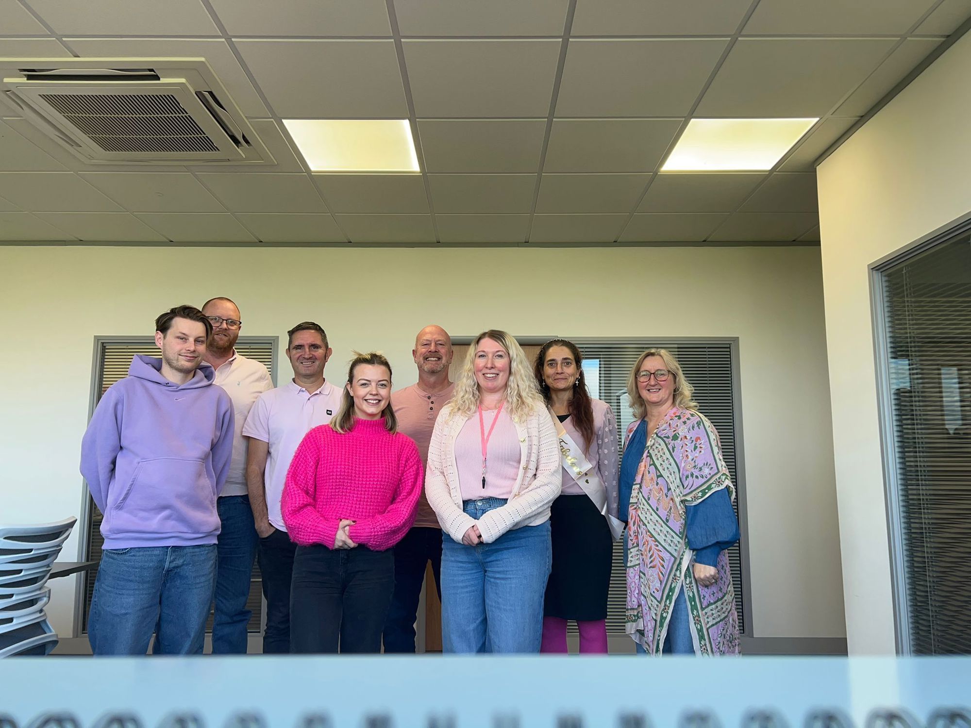 Unette staff wear it pink fund raising